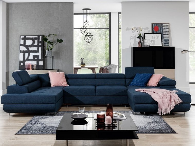 Navy U-shaped corner sofa bed with storage in a bright living room