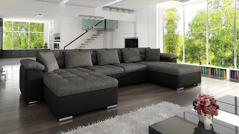 U-shaped Goldcrest corner sofa bed in dark grey fabric with a black leather-look base and chaises at both ends