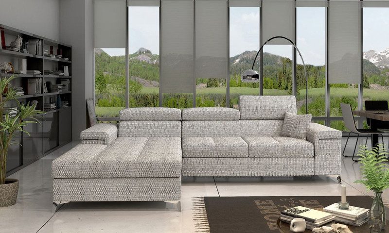 Light grey woven Pinehollow corner sofa bed with adjustable headrests and the chaise on the left, in front of tall windows with a mountain view and a dark bookcase