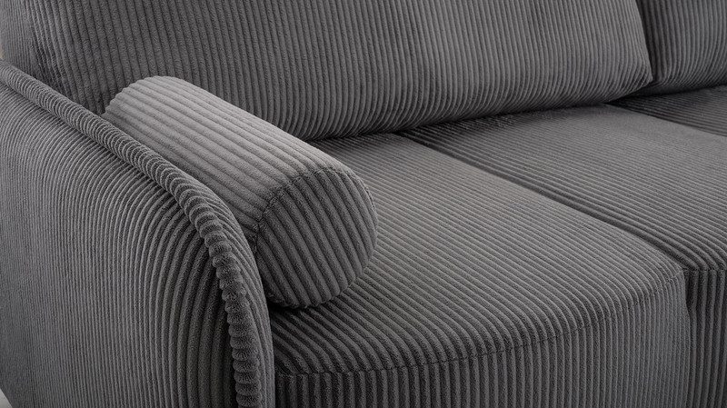 Close-up of grey cord fabric on a Dunbarrow sofa seat, rounded arm and bolster cushion, showing the ribbed pile