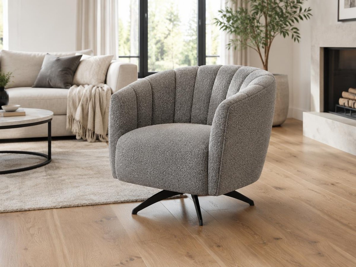 Grey Bramcote swivel chair with a channelled back and black four-star base in a living room