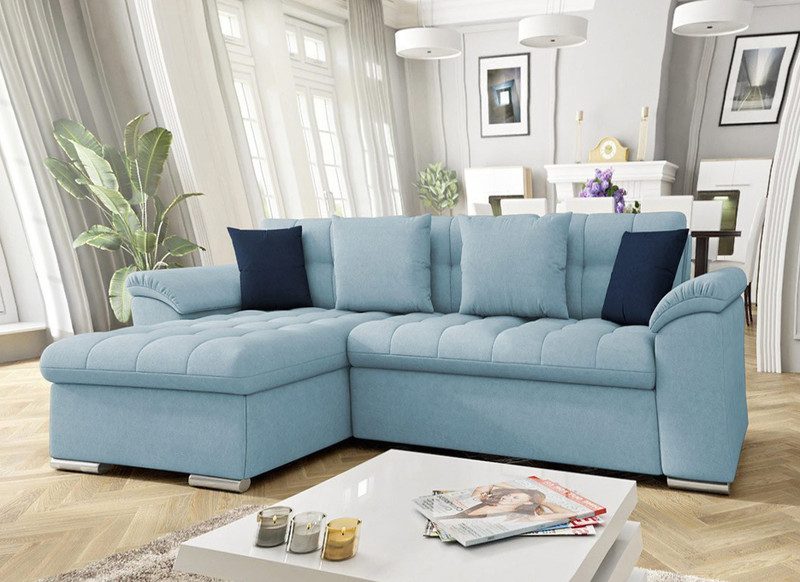 Light blue Goldcrest Mini corner sofa bed with storage, chaise on the left, with navy and light blue scatter cushions in a bright living room