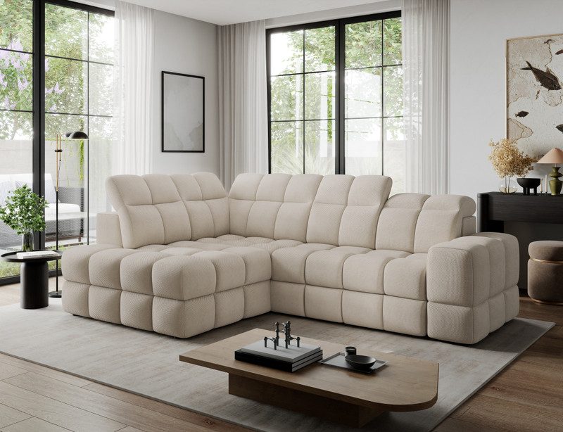 Cream Yeoman corner sofa bed with deep-quilted cushions, set in front of tall black-framed windows with sheer curtains in a bright living room