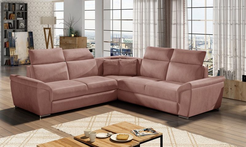 Dusty pink Quillon corner sofa bed with two long sides, adjustable headrests and the corner on the right, in front of tall windows and sheer curtains