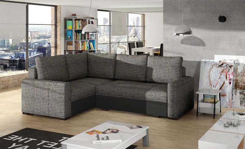 Grey flecked woven Granby corner sofa bed with a black base and the corner on the left, beside a white coffee table in a loft-style living room