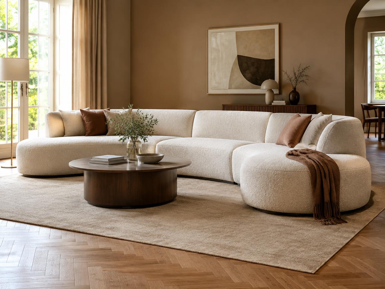 Cream Wrenbury corner lounge sofa with soft curved edges from the Exclusive Designer Collection in a warm-toned living room